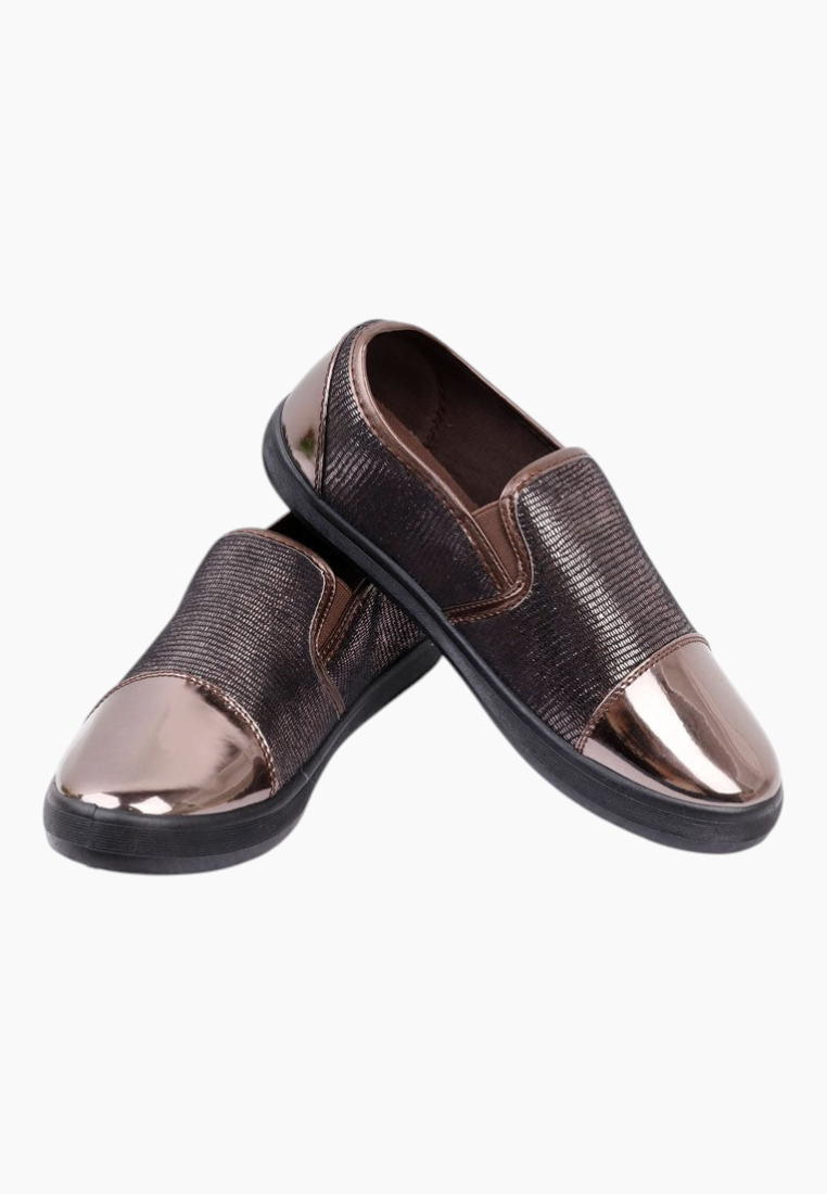 Close-up detail of the brown slip-on shoes highlighting the metallic finish.