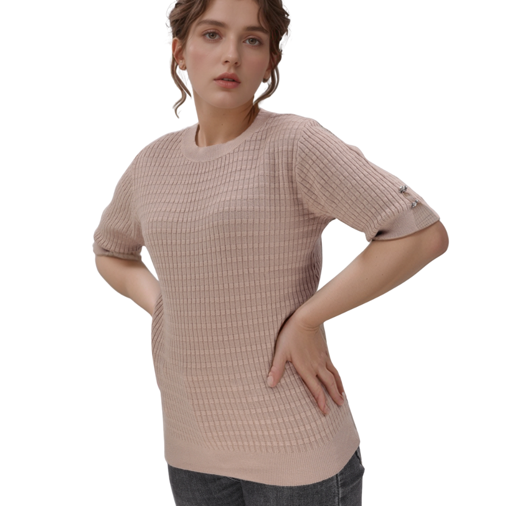 Front view of a light pink top featuring short sleeves and textured fabric.