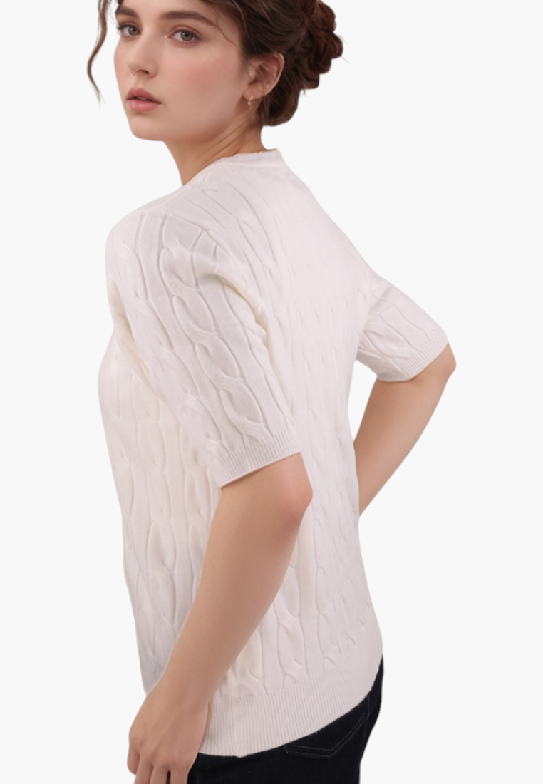 Back view of the cream short-sleeve sweter with button closure.