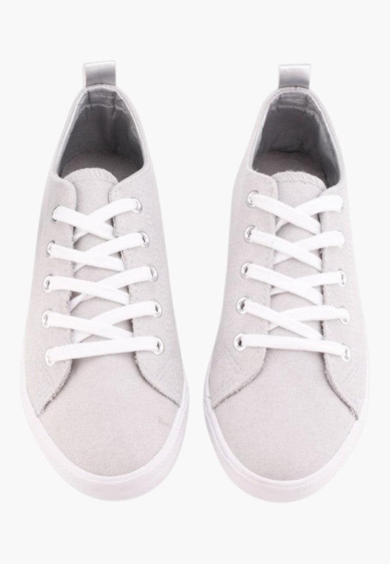 Top view of gray eco-suede sneakers showcasing lace-up design.