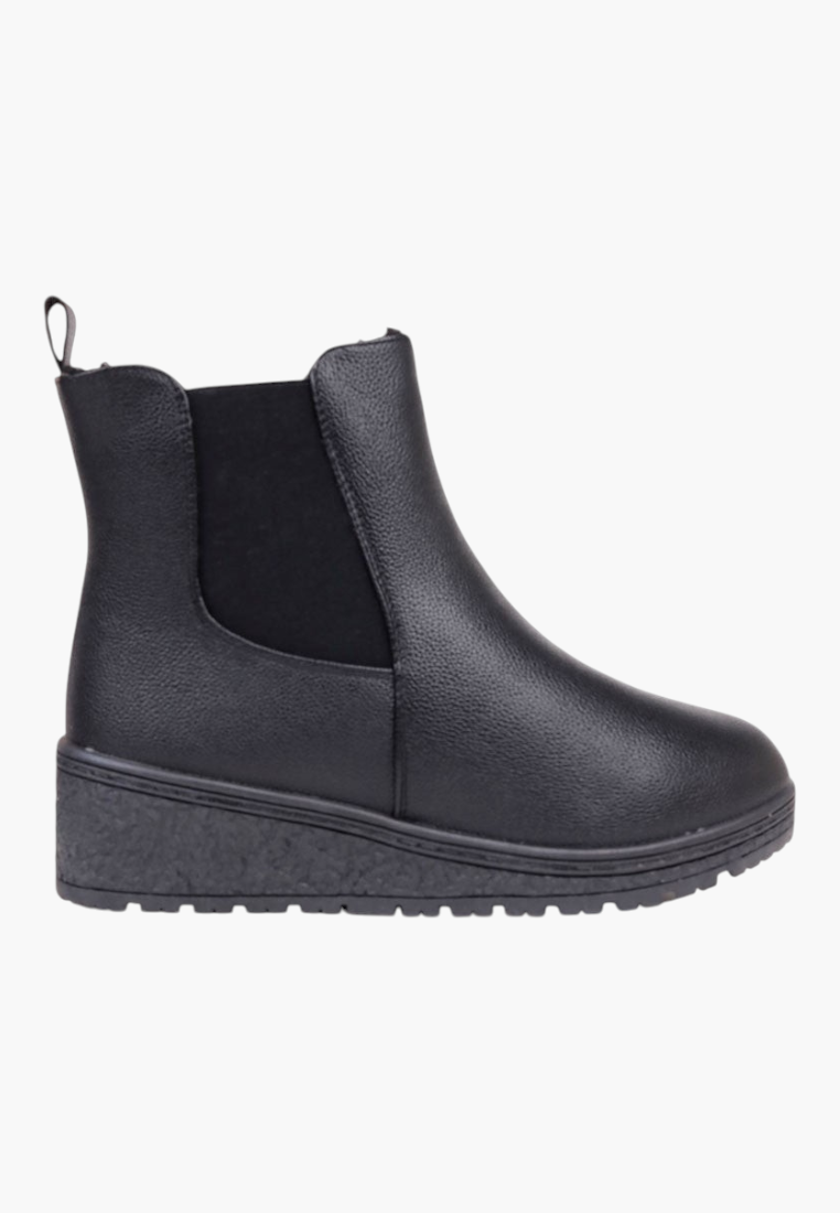 Side view of black ankle boots showcasing chunky sole and sleek design on a white background.