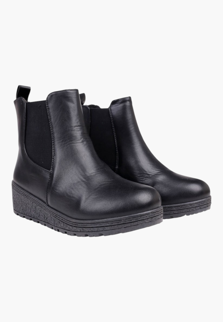 Front view of black ankle boots with chunky sole and slip-on design.