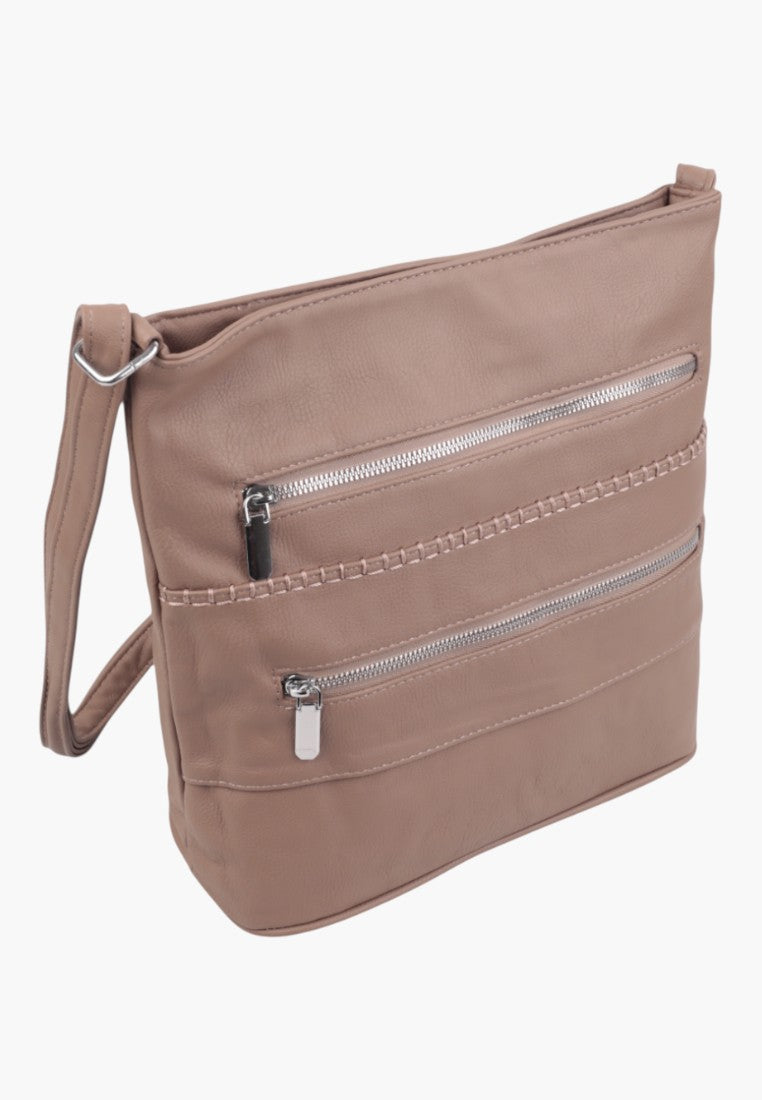 Side view of a beige shoulder bag featuring a zippered closure and smooth texture.