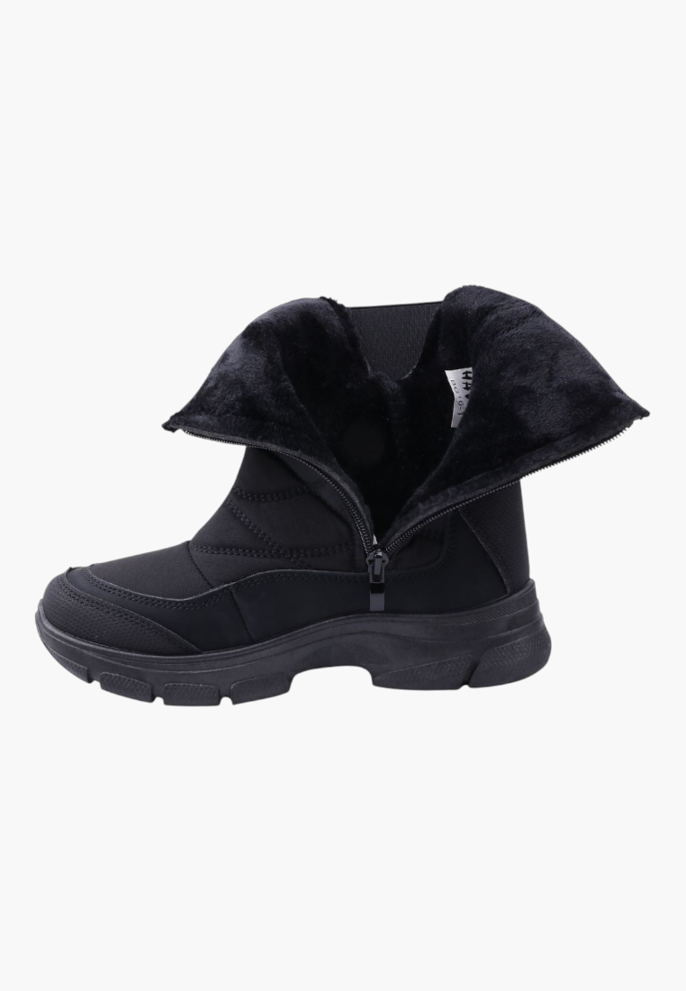 Falio black softshell snow boots with quilted upper, side zipper, and warm fleece lining on a thick rubber sole.