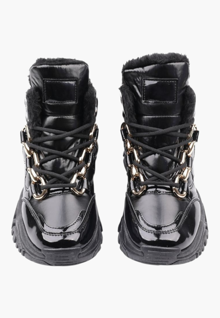 Falio black ankle sneakers with patent faux leather, lace-up front, and decorative gold chain detail.