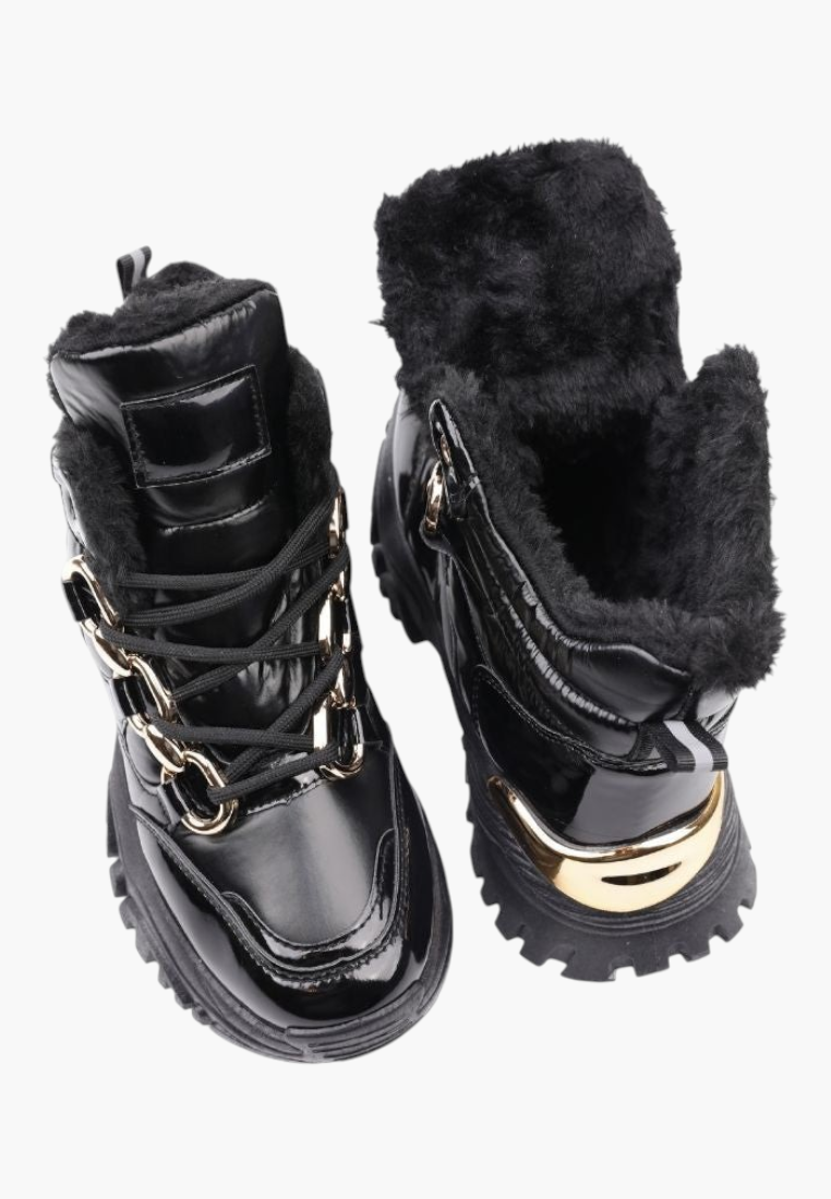 Falio black ankle sneakers with patent faux leather, fur lining, gold chain detail, and chunky flat soles.