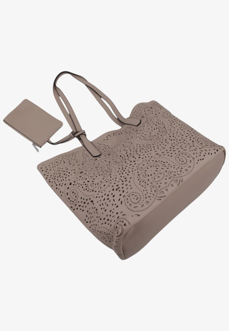 Side view of a beige tote bag featuring long handles on a white background.