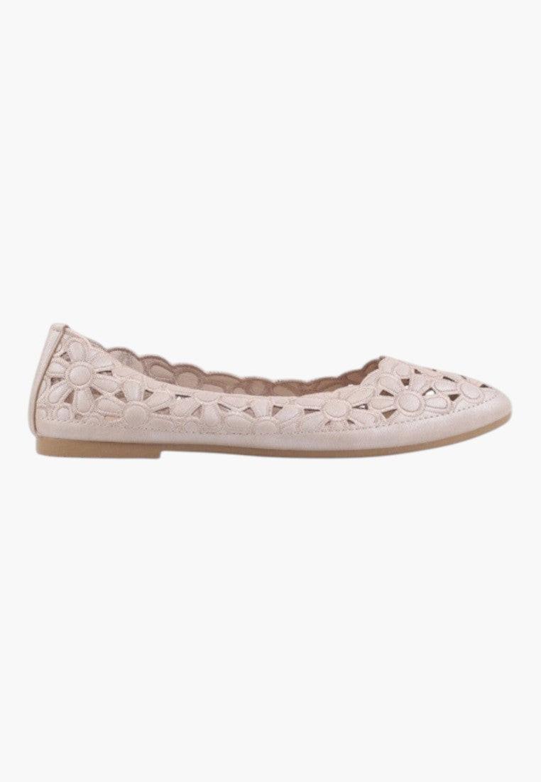 Side view of beige ballet flats with a perforated design and flat sole.