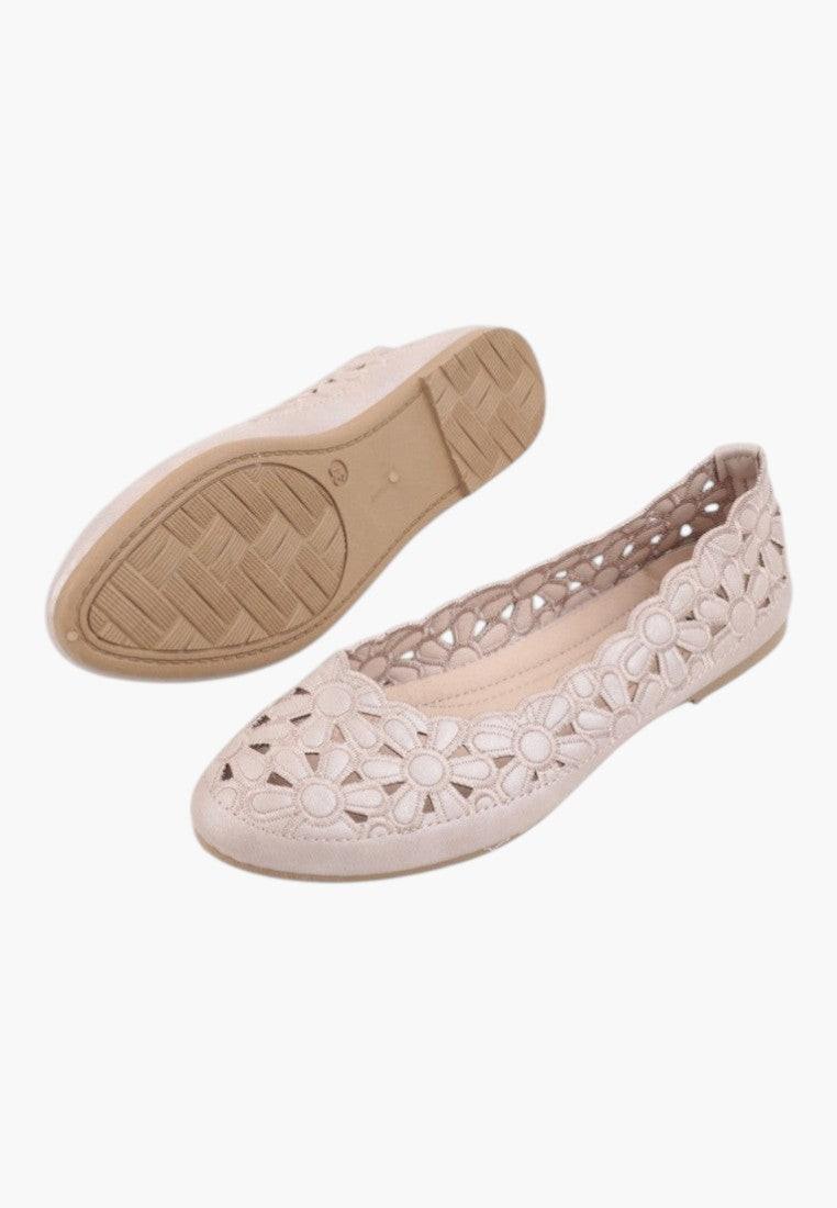 Back view of beige ballet flats highlighting the cut-out design.