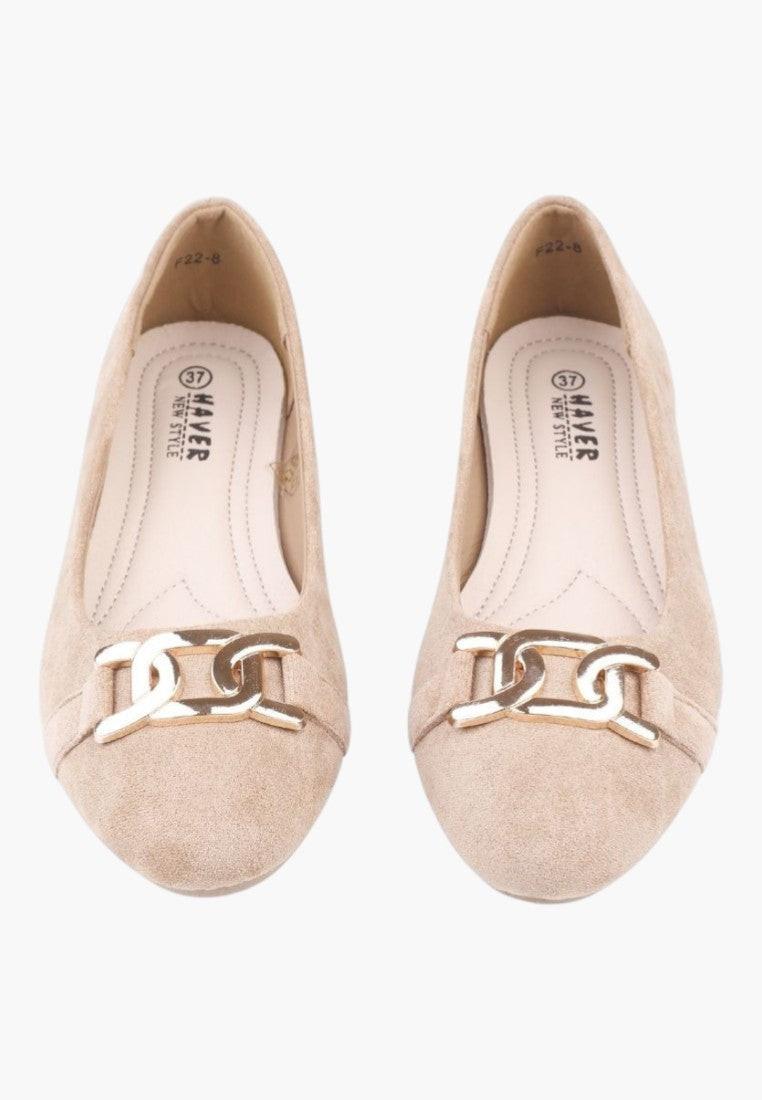 Side view of beige ballet flats showcasing the flat sole design