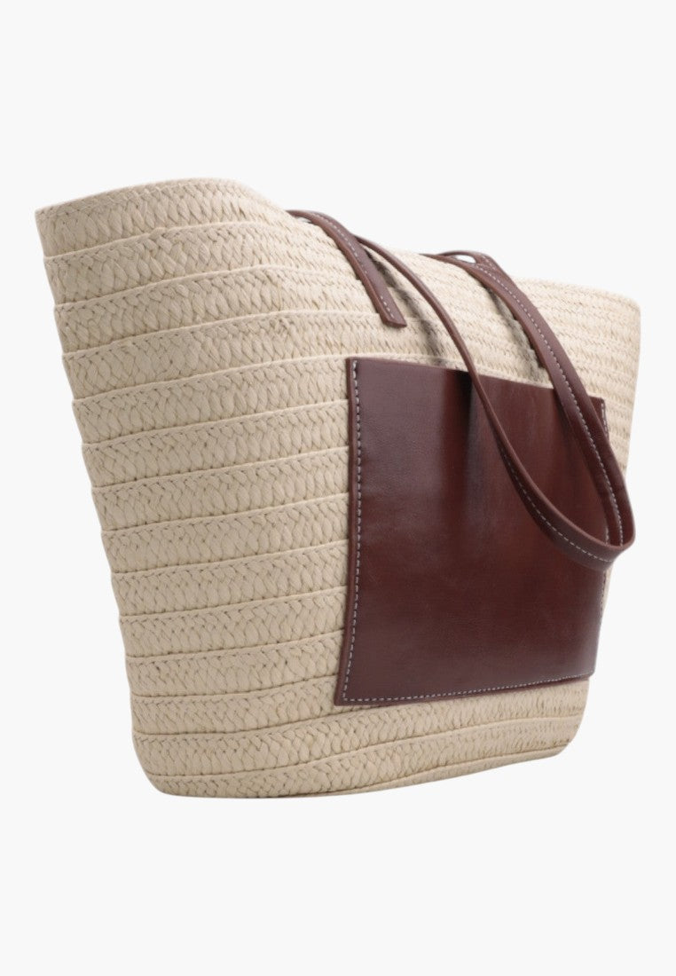 Side view of the beżowa torebka shopper z długimi paskami i widokiem bocznym.