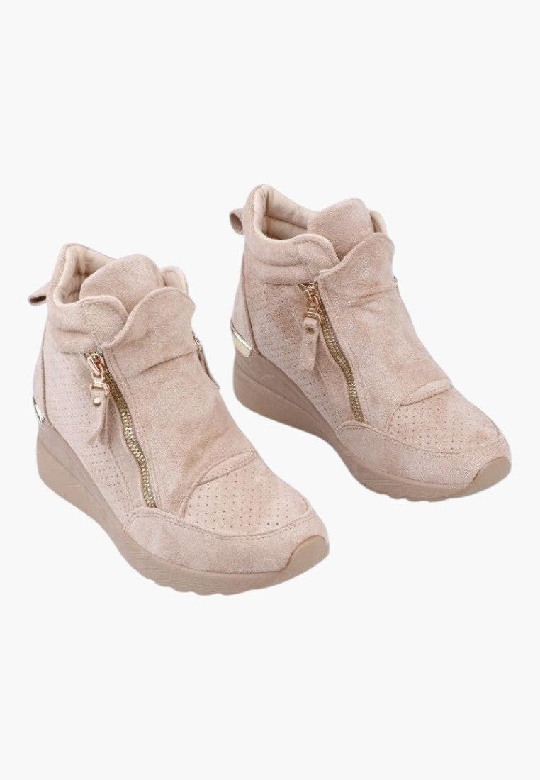 Front view of beige wedge sneakers with zipper closure on a white background