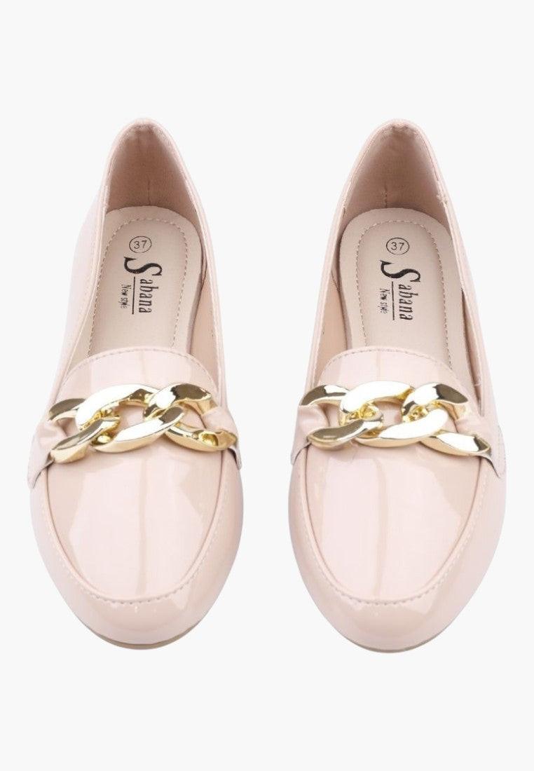 Top view of beige loafers with a comfortable fit on a white background