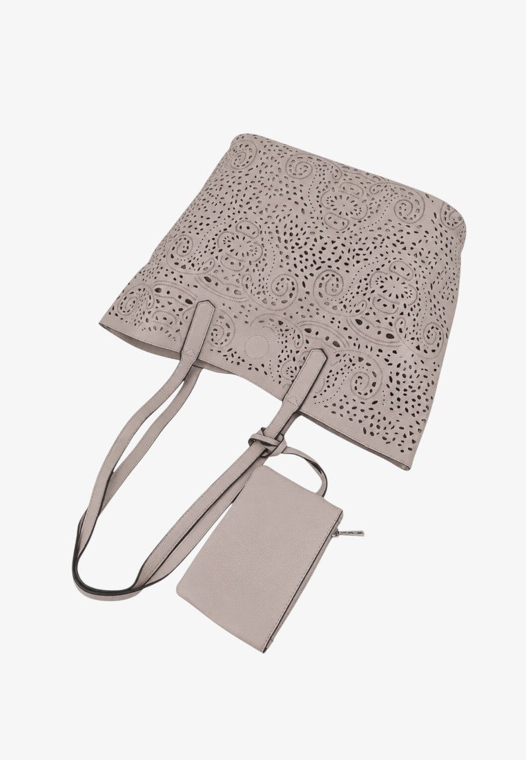 Side view of a beige tote bag showcasing a simple silhouette and double handles on a white background.