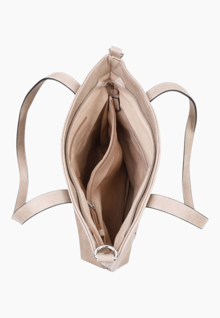 Detail of the beige tote bag's spacious interior with multiple compartments.