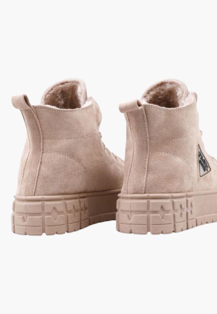 Back view of beige sneakers with a high-top design and logo detail