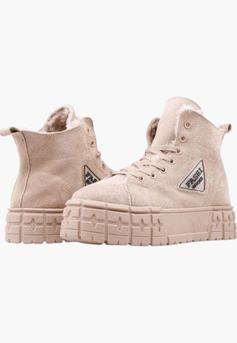 Front view of beige sneakers with a high-top design and logo detail