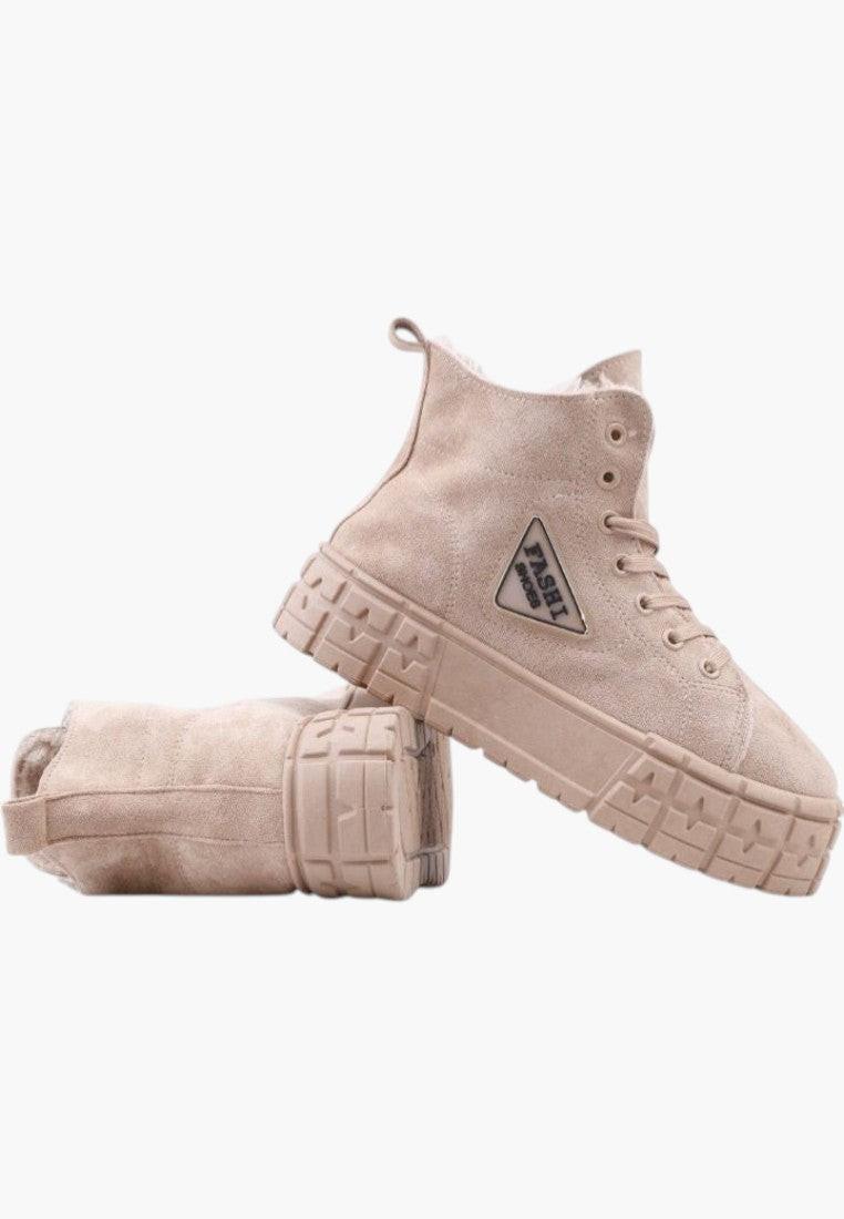 Side view of beige sneakers featuring a platform sole and logo detail