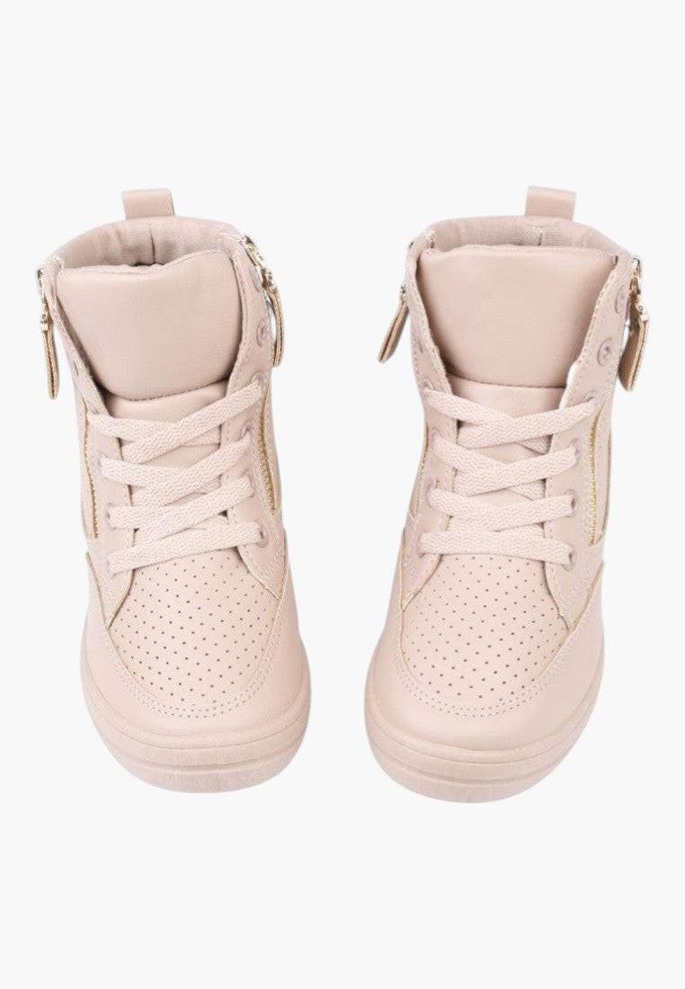 Close-up detail of beige wedge sneakers showing textured sole and lace-up design