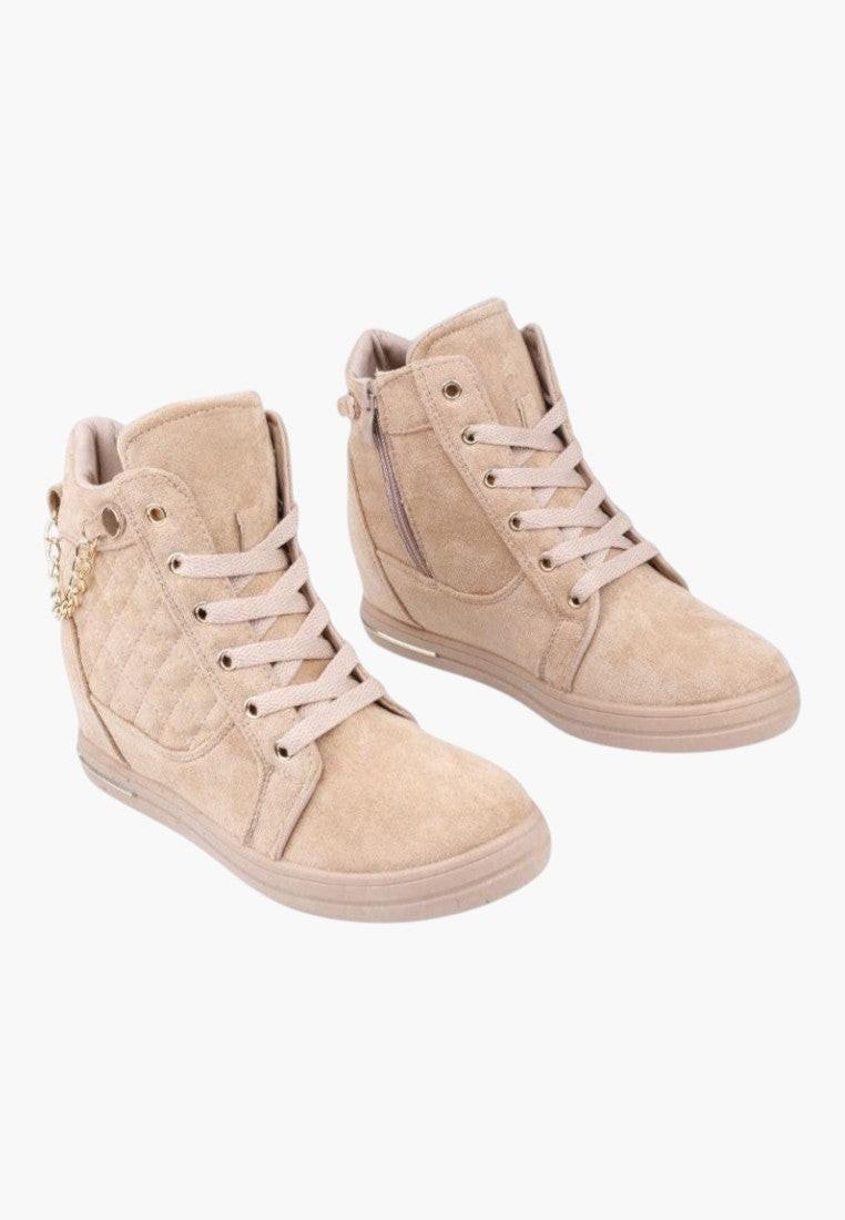 Front view of beige wedge sneakers with lace-up design on a white background