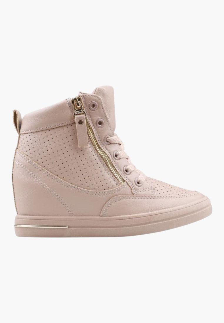 Side view of beige wedge sneakers highlighting wedge heel and zipper detail