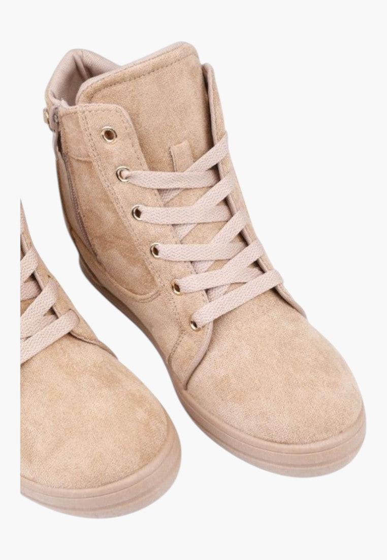 Back view of beige high-top sneakers with zipper detail on a white background