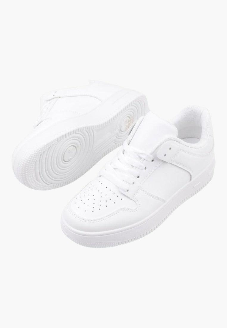 Front view of white sneakers with lace-up closure and rubber sole.