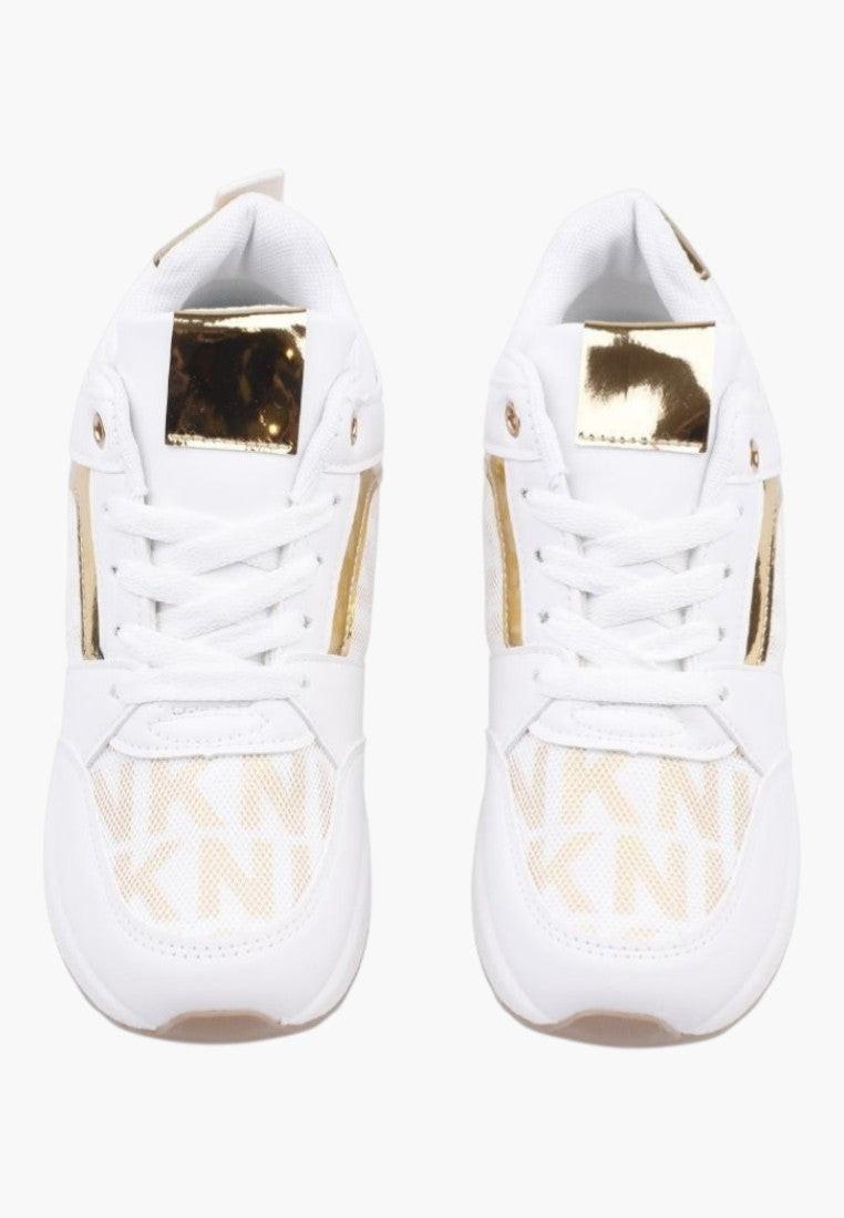 Front view of white and gold sneakers displaying logo details