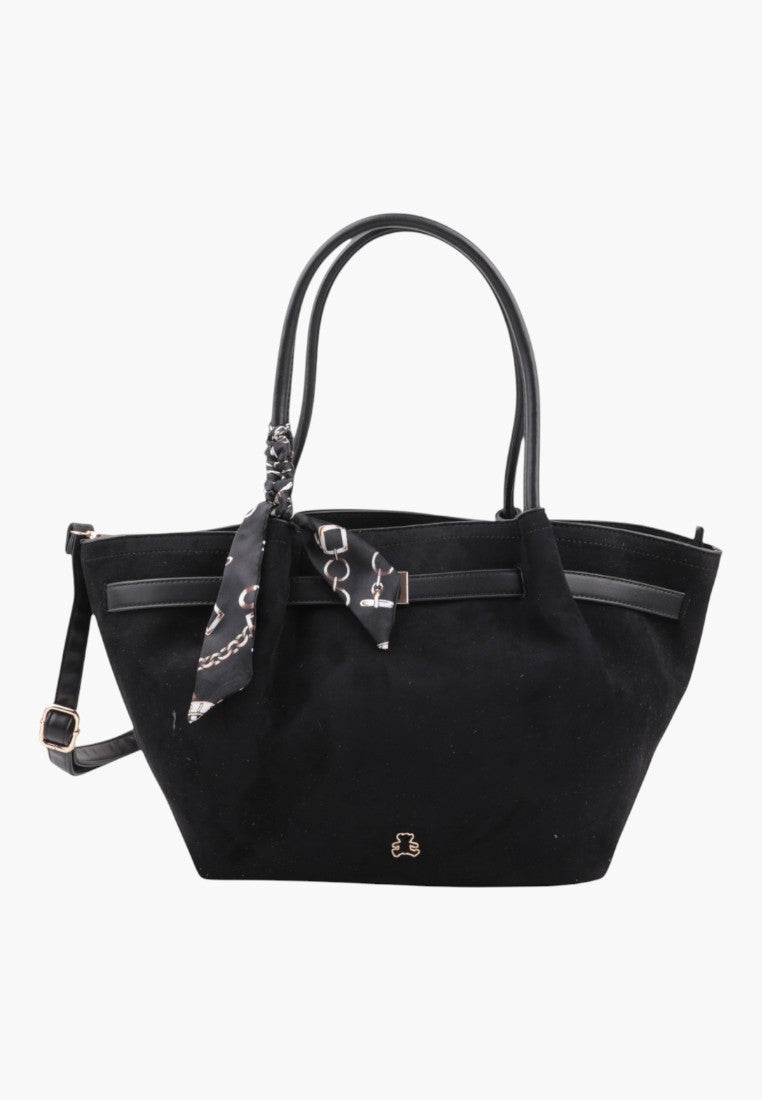 Front view of the black faux leather shopper bag with patterned scarf.