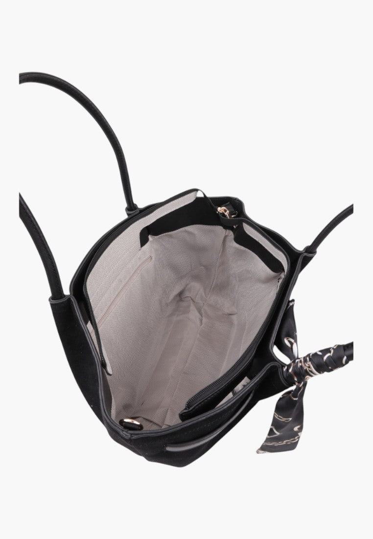 Detail view of the interior of the black faux leather shopper bag with zipper closure.