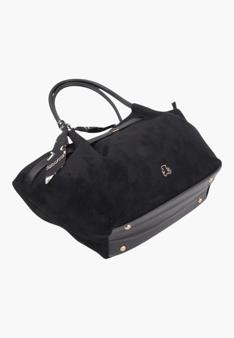 Side view of the black faux suede shopper bag with decorative scarf and logo.