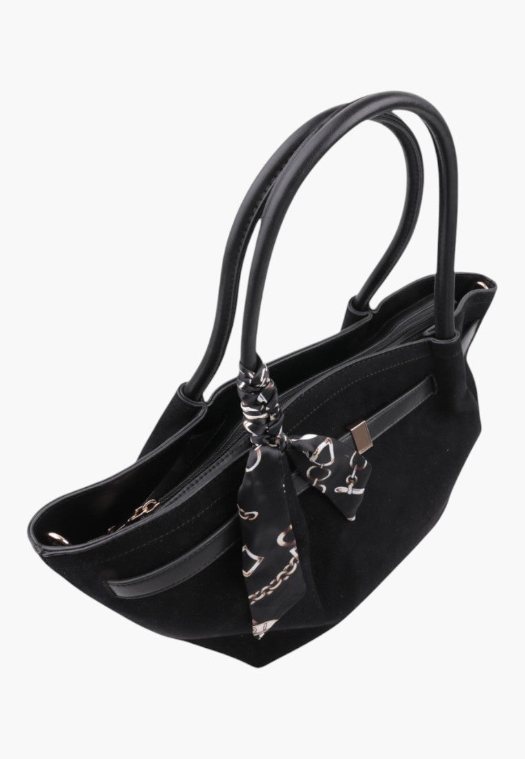 Side view of the black faux suede shopper bag with top handles and scarf accessory.