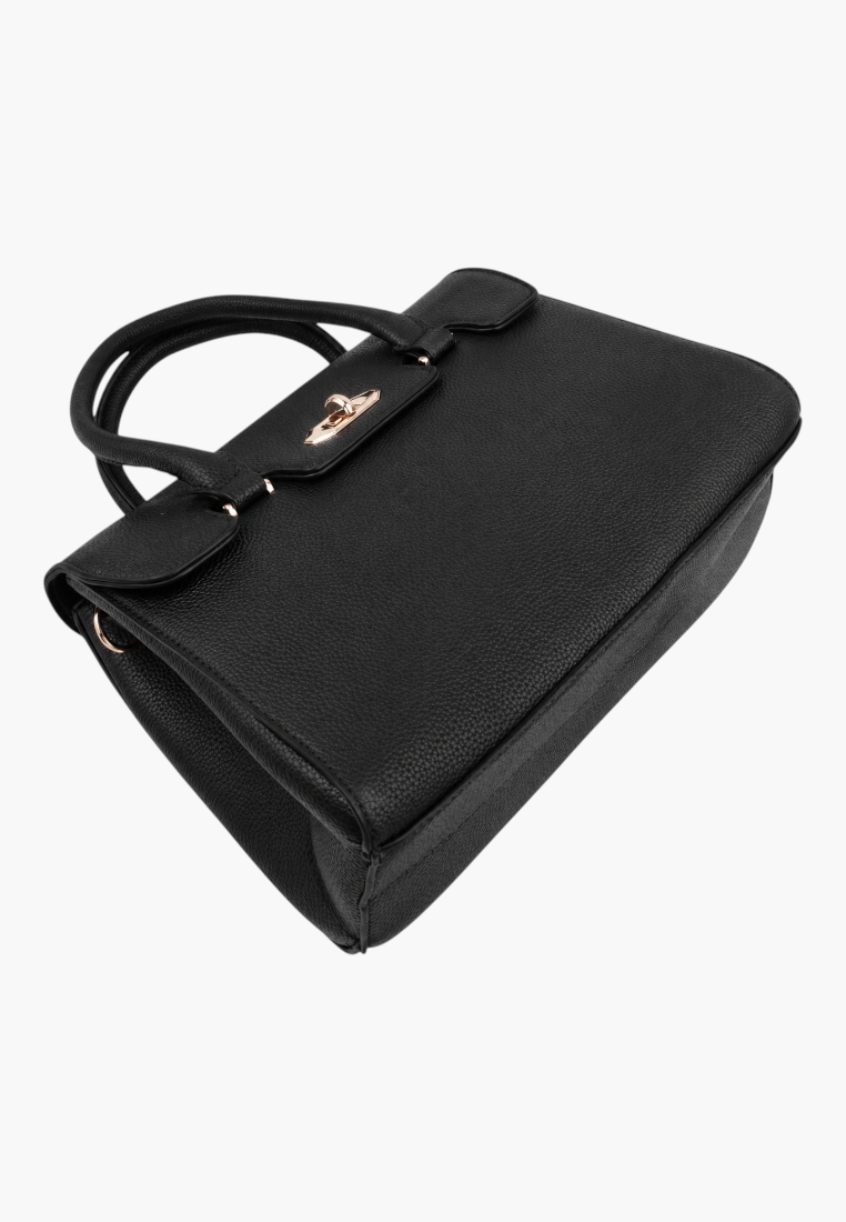 Side view of a black handbag with top handles and a structured design on a white background.