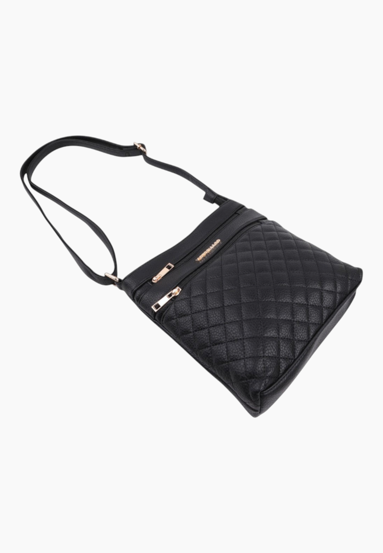 Side view of the black quilted handbag with adjustable strap and zipper closure.