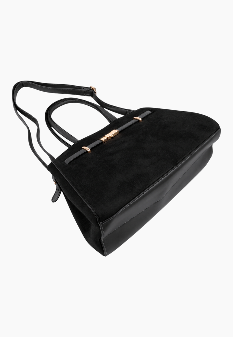 Top view of the black handbag highlighting the gold clasp.