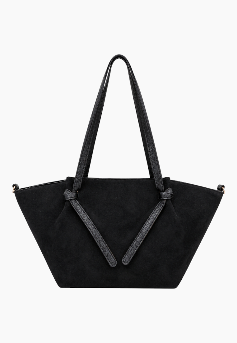 Back view of the black handbag showcasing suede material and gold hardware.
