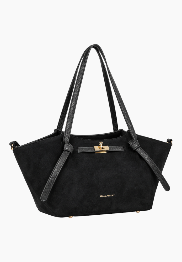 Front view of the black handbag with suede material and gold hardware.