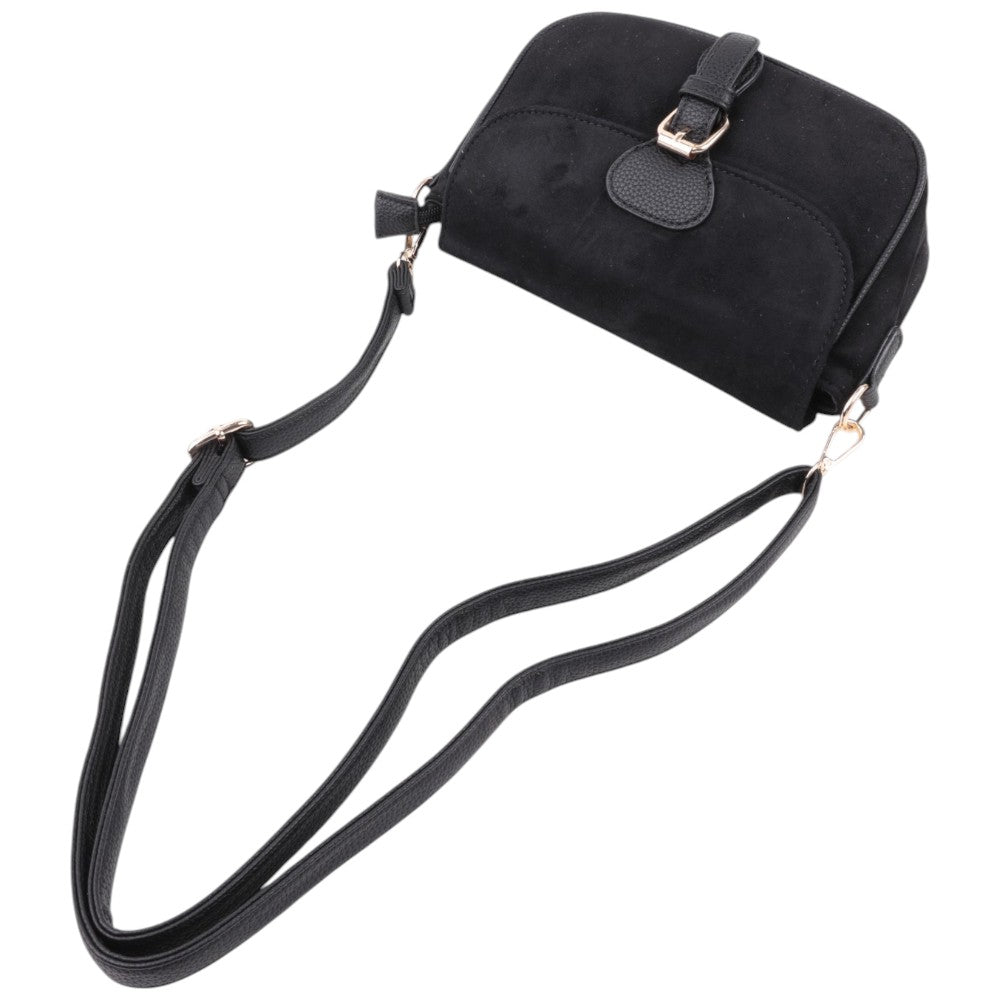 Side view of the black suede handbag highlighting the flap closure and gold accents.