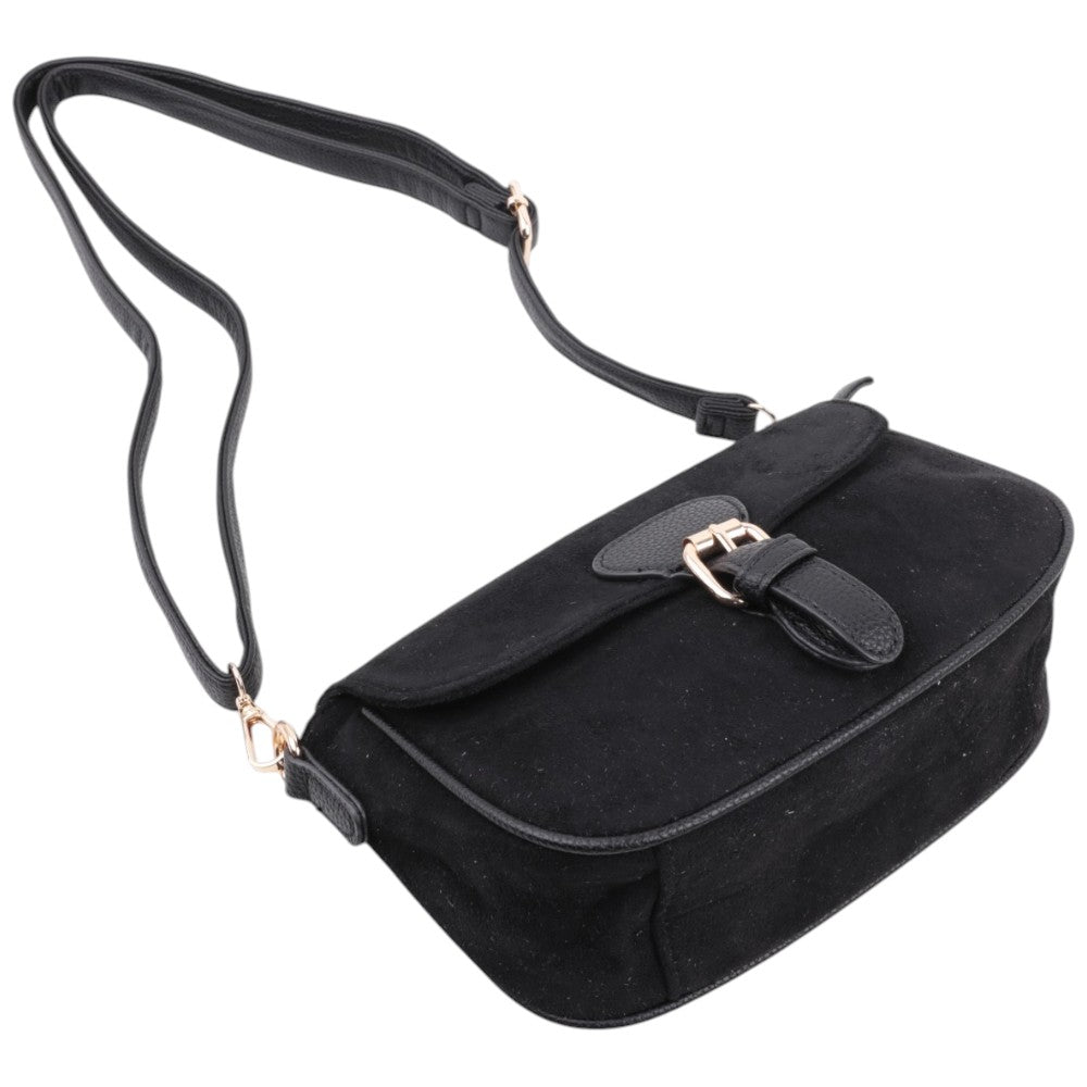 Side view of the black handbag with a shoulder strap and gold hardware.