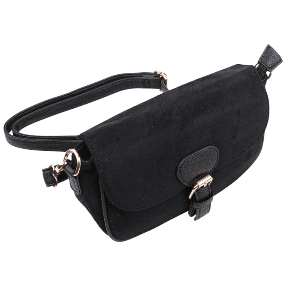 Side view of the black handbag featuring a flap closure and gold hardware.
