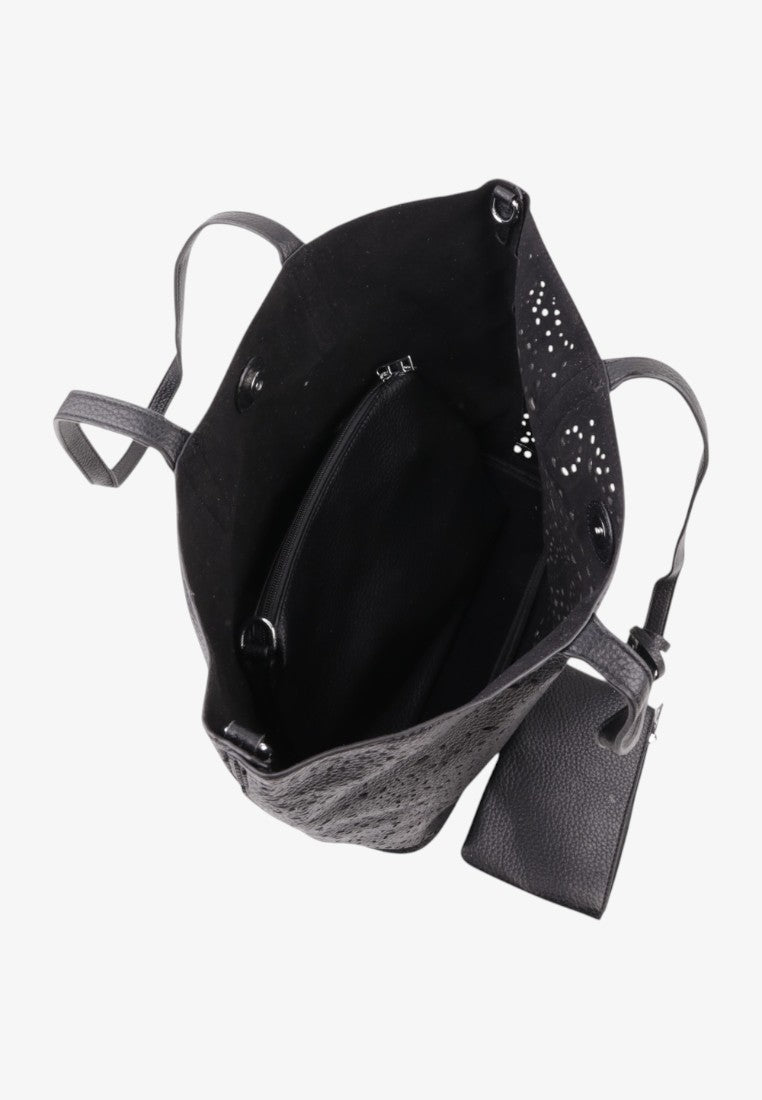 Detail close-up of the interior of a black handbag with multiple pockets and soft lining.