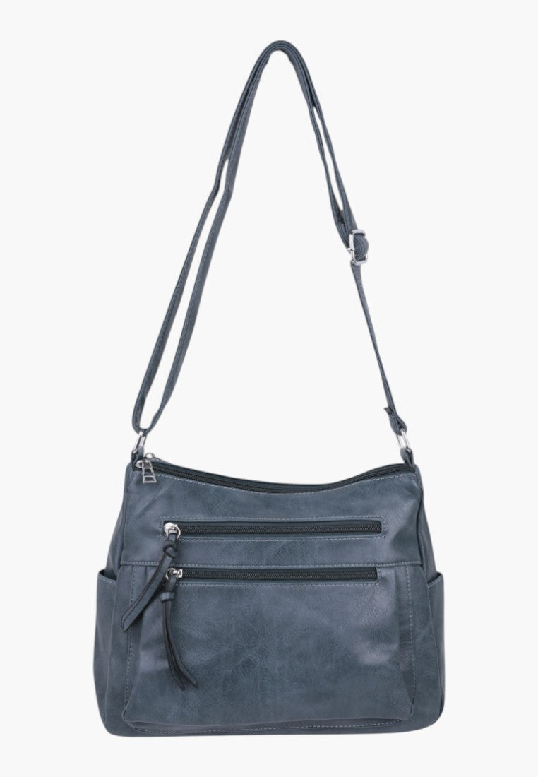 Listonoszka w niebieskiej skórze ekologicznej, widok z przodu.