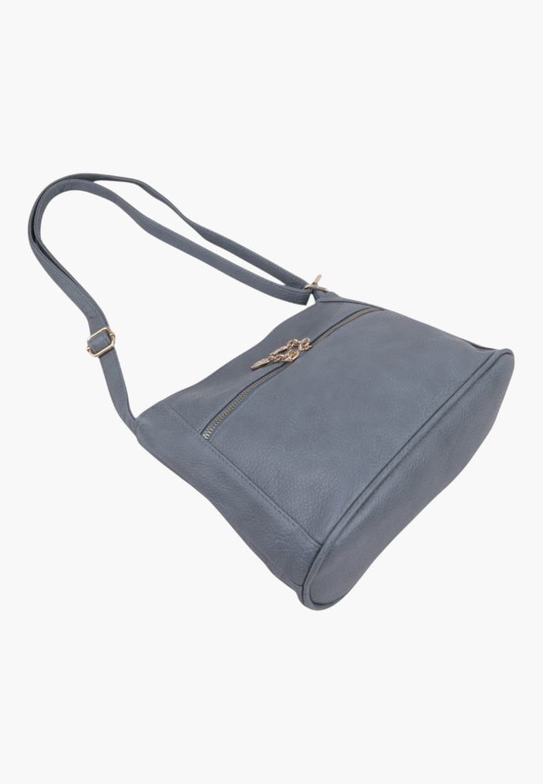Side view of a blue handbag with two straps and gold hardware on a white background.