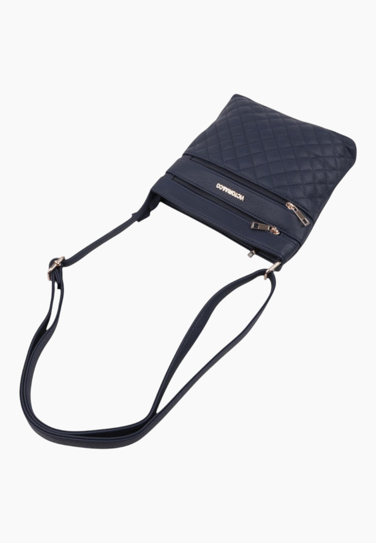 Angled view of the navy handbag highlighting zipper details.