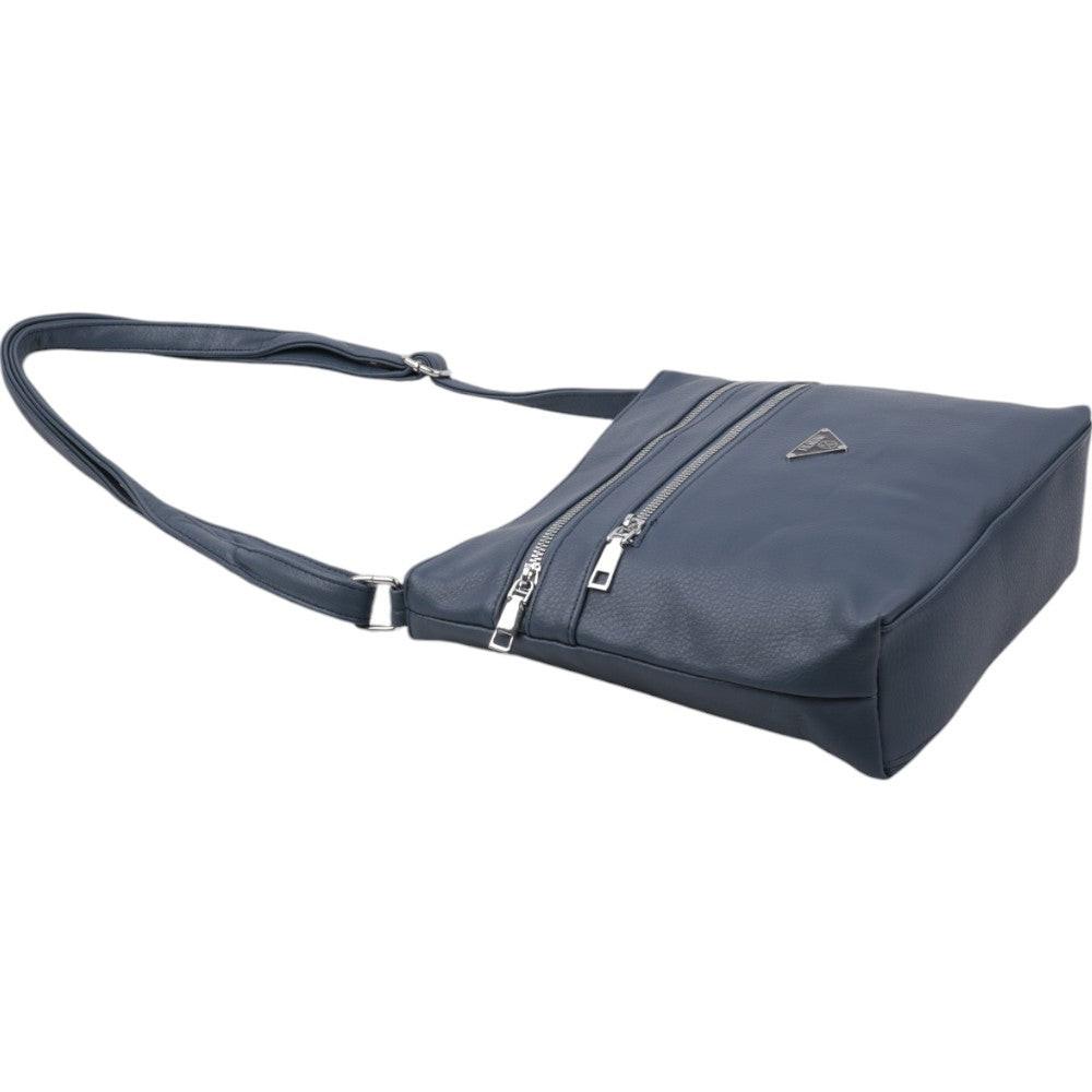 Side view of a blue shoulder bag with a zipper closure and adjustable strap on a white background.