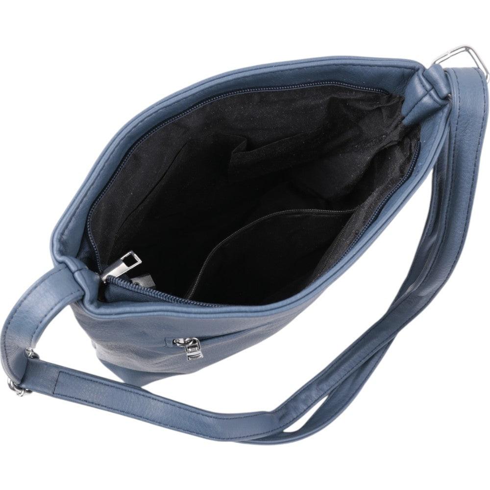 Detail view of a blue shoulder bag showing its interior pocket and soft lining on a white background.