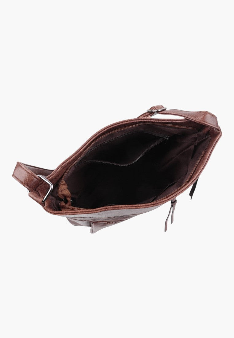 Detail of brown faux leather crossbody bag with open top and interior zip pocket.