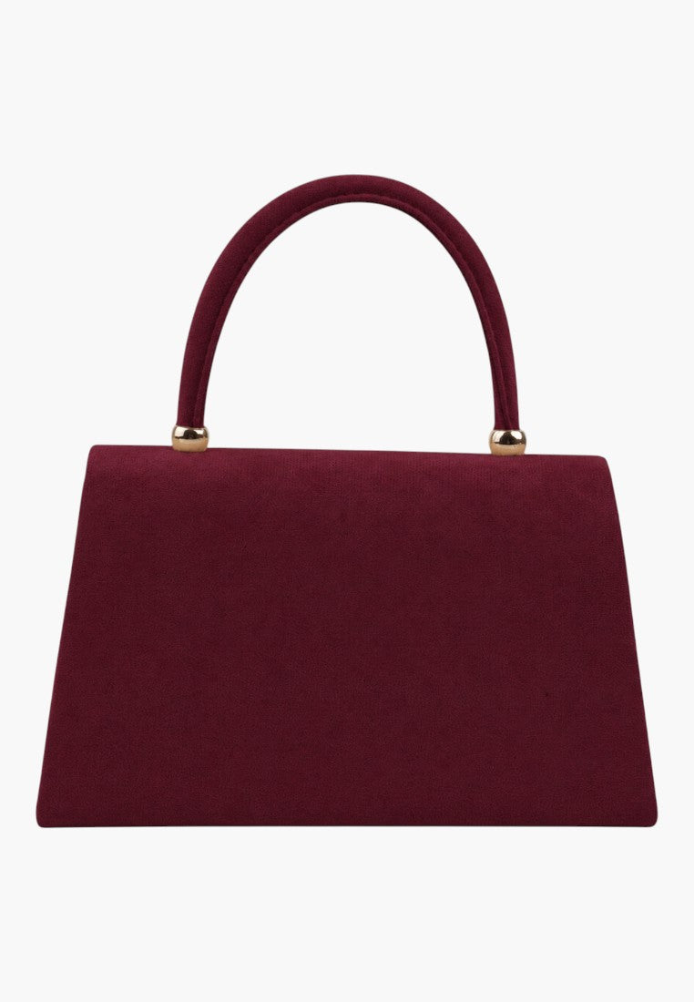 Back view of a burgundy handbag with a top handle and flap closure