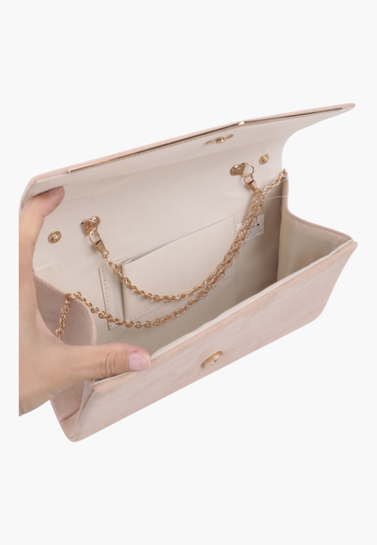 Detail view of the beige faux leather evening clutch with gold chain strap and internal pocket.