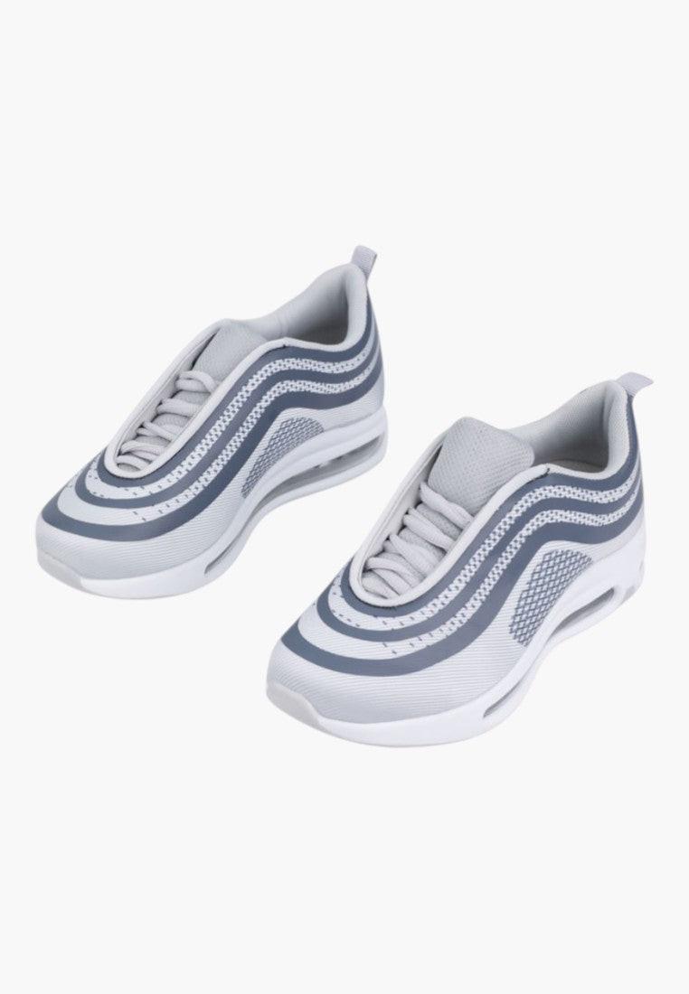 Ciemno szare buty sportowe damskie z innego kąta, z teksturowanym wierzchem na białym tle.